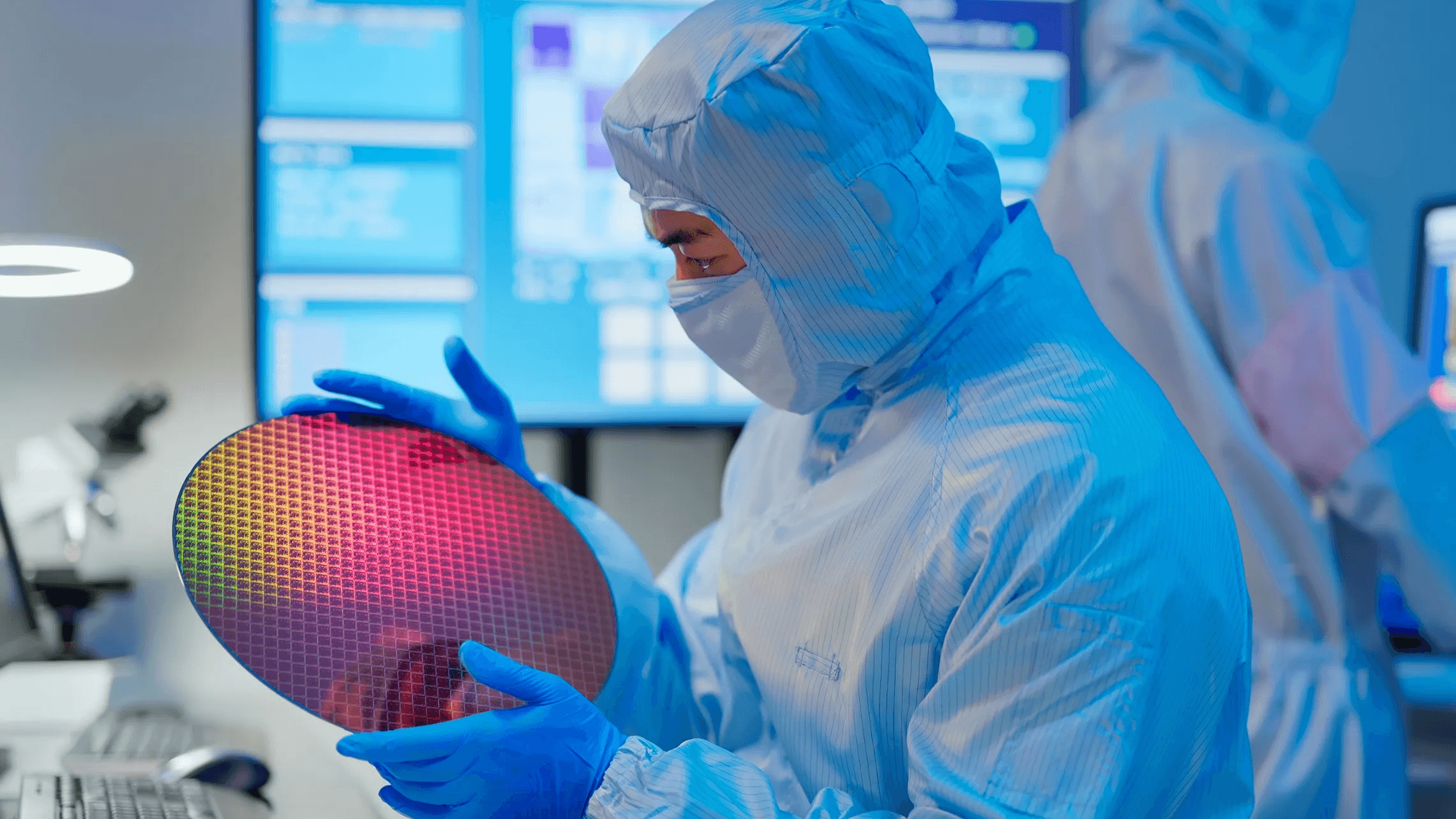 Technician-with-wafer-in-semiconductor-FAB